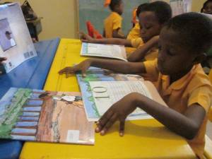 Students in Haiti reading Fabiola